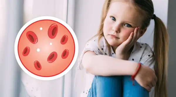 Smutna dziewczynka z niskimi leukocytami. Obok niej okrąg z czerwonymi krwinkami i kilkoma białymi, symbolizującymi niskie leukocyty.
